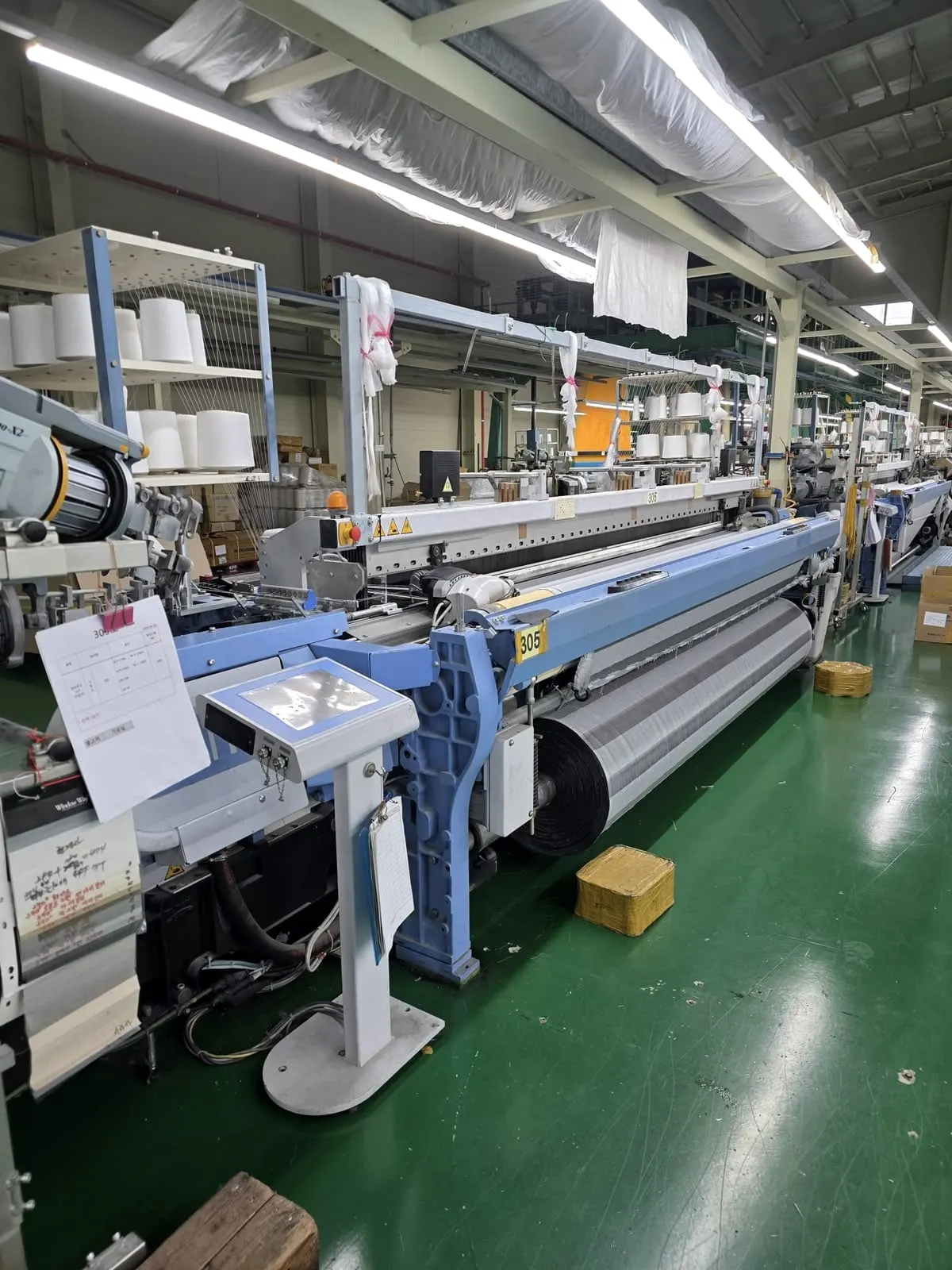 Air-jet looms in a modern weaving hall