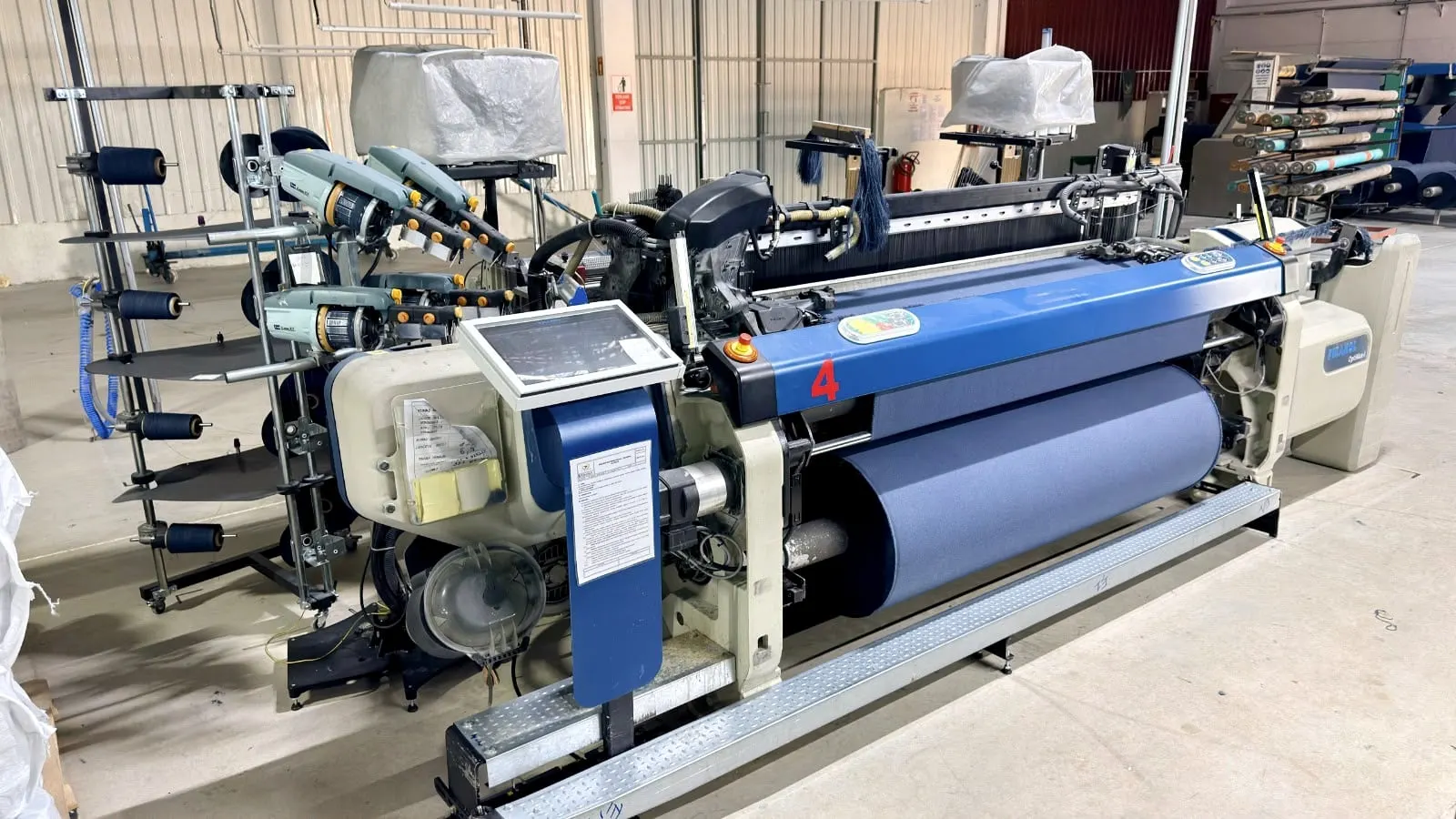 Picanol rapier loom with blue cloth beam