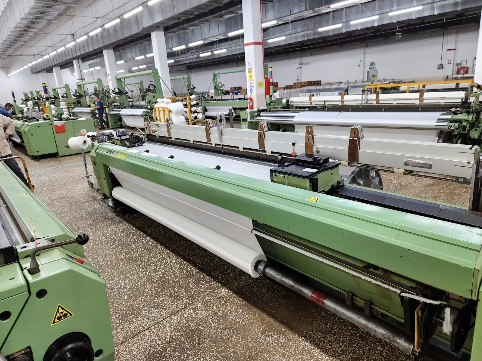 Hall of green Sulzer projectile looms